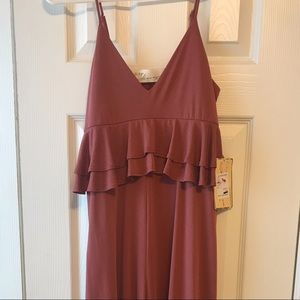 Fit and flare jumper with ruffle details.